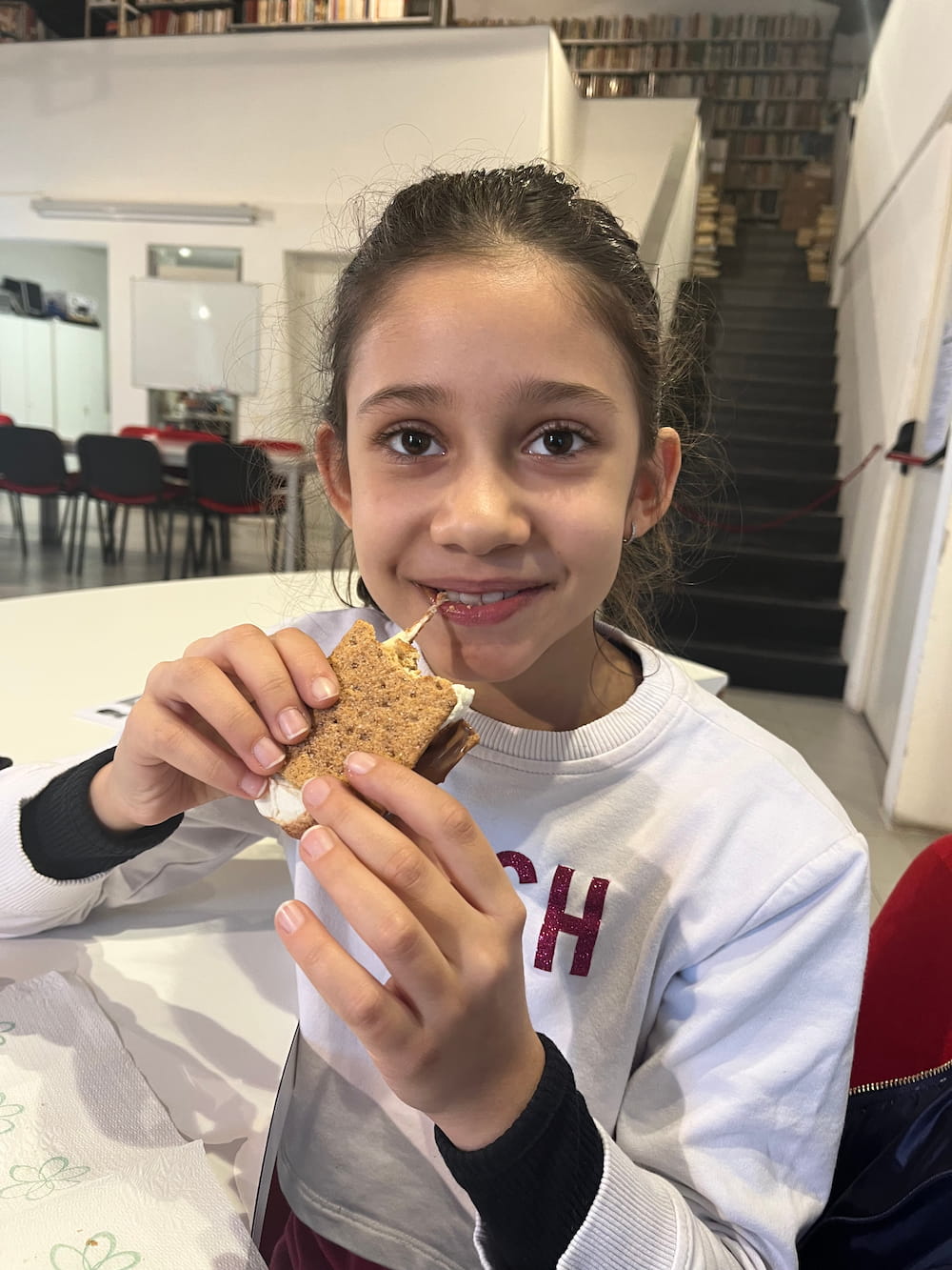 An Italian student trying smores for the first time