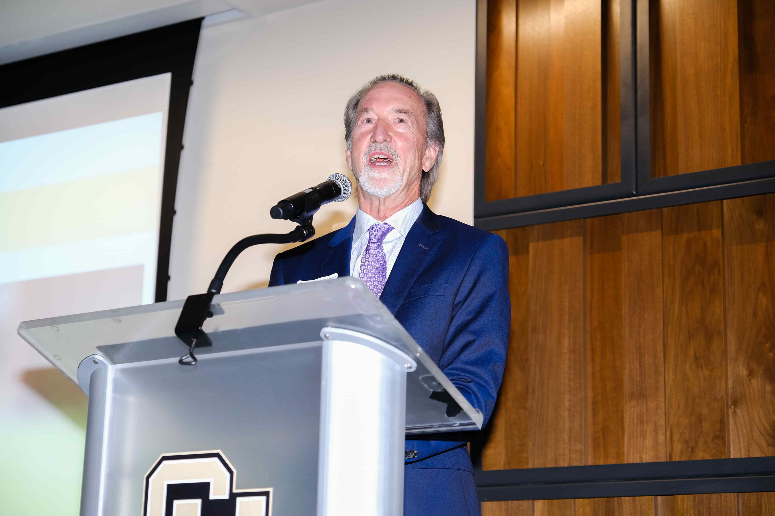 Reed Martin accepting the award for Dr. Rebecca Kantor